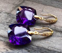 "Purple Amethyst earrings. Gold Pave earrings. Ultra violet. Statement jewelry. February birthday. Deep purple stones and yellow gold are luxury and beautiful together- royal combination of colors. I have only two pairs of earrings , so choose a stone: A) 36 carats both, each is 17x17x11 mm. B) 25 carats both, each is 16x16x10 mm. As photo. Length of earrings is about 1 1/3\". Available in different finishes. They will arrive in a beautiful jewelry box." Elegant Purple Earrings For Pierced Ears, Luxury Purple Earrings For Anniversary, Luxury Purple Jewelry Gift, Elegant Amethyst Earrings, Elegant Amethyst Purple Earrings, Elegant Purple Amethyst Earrings, Elegant Purple Earrings For Gift, Amethyst Gemstone Earrings For Party, Gold Amethyst Earrings For Parties