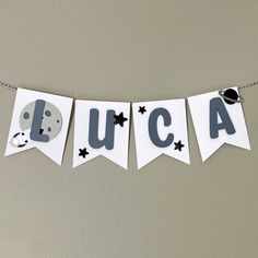 a banner that says lucas hanging from a string