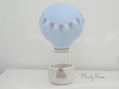 a blue hot air balloon sitting on top of a white table