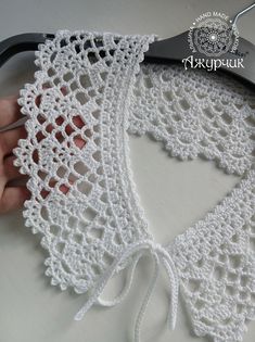 a pair of scissors is being used to crochet lace