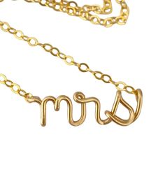 "Mrs lowercase classy script necklace. Made from 14k gold filled wire and chain. The model wears a 16\" necklace. What is 14k gold filled? It is 14k solid gold heat bonded to brass. The coating of gold is 1000x thicker than gold plated. It can last a lifetime if cared for properly. Care instructions will be included. Have questions? Concerns? I'd love to chat with you! ◊◊ Message me on Etsy convo here: https://www.etsy.com/conversations/new?with_id=7293349 OR email me at: aziza [!at] azizajewelry.com ◊◊ Stay a while, keep shopping: http://www.etsy.com/shop/AzizaJewelry ◊◊ Shipping:  Standard Shipping within the US is via USPS First Class Mail, ships within 3-5 days and can take 7-10 business days to arrive  ◊◊ RUSH Priority Mail ships within 1-2 business days and takes 3-5 days to arrive ◊ 14k Gold Charm Necklaces For Wedding And Mother's Day, Gold Custom Name Charm Necklace For Wedding, Gold Charm Necklace With Custom Name For Wedding, Custom Name Gold Necklaces For Wedding, Dainty Custom Name Necklaces For Wedding, Gold Name Necklace For Wedding, Custom Name Gold Necklace For Wedding, Elegant Gold Name Necklace For Bridesmaid, Elegant Adjustable Wedding Name Necklace