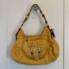 Yellow Hobo Bag Color: Goldenrod Small Pocket Under Magnetic Flap, Another Tiny Pocket On Back Of Bag Interior Has Both Zipper Pocket And Non Zipper Pocket New With Tags, Never Used Comes With Dust Bag Leather Bags With Buckle Closure For Shopping, Chic Hobo Bag With Silver-tone Hardware For Shopping, Double Handle Hobo Bag With Metal Hardware, Hobo Bag With Silver-tone Hardware For Errands, Yellow Bags With Metal Hardware For Everyday Use, Elegant Yellow Bag With Silver-tone Hardware, Elegant Yellow Bags With Silver-tone Hardware, Yellow Bags With Silver-tone Hardware For Everyday Use, Yellow Leather Bags With Metal Hardware