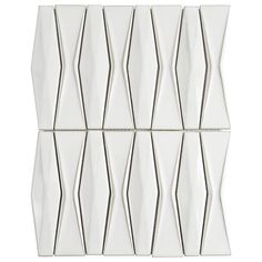 six white glass tiles with silver lines on them