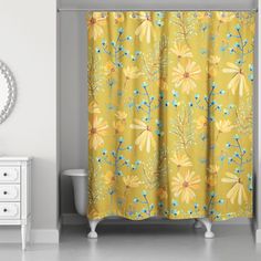 a bathroom with a yellow shower curtain next to a white dresser