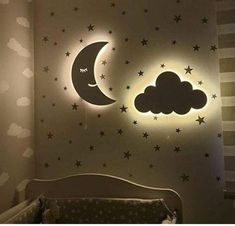 a child's bedroom with stars and moon wall decals