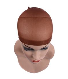 This upgraded wig cap is more comfortable and successful wig-wearing. It stretches to cover your own hair and helps to hold the hair in. And the most important part is that it is better for those who have a short haircut.  It is softer, helps wigs to fit better, prevents slipping, and protects your hair from friction. One Size Fits All. Material: Mesh Nylon Color Shown: Brown/Dark Brown 2 pieces /package Hair Bun Tool, Making Wigs, Hair Extension Tools, Christmas Wear, Hair Nets, Stocking Cap, Braided Ring, Hair Net, Wig Caps