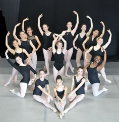 a group of ballet dancers posing for a photo