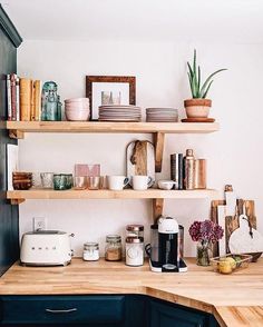 an instagram photo of a kitchen counter with coffee cups and other items on it