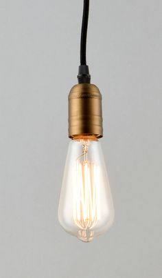 an old fashioned light bulb hanging from the ceiling