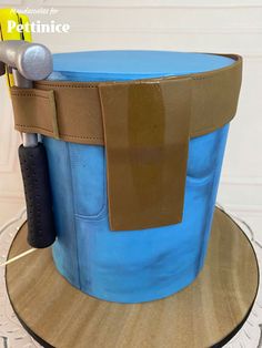 a blue and brown hat with tools in it