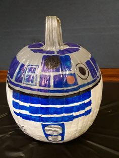 a blue and white painted star wars pumpkin