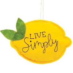 a lemon ornament with the words live simply written on it