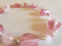 Beautiful pink heart rosary Elegant Pink Beaded Bracelets With Heart Beads, Elegant Pink Heart Beaded Bracelets, Elegant Pink Beaded Bracelet With Heart Charm, Elegant Pink Heart-shaped Beaded Bracelets, Elegant Pink Beaded Heart Bracelet, Pink Single Strand Beaded Bracelet Gift, Pink Single Strand Beaded Bracelet As Gift, Pink Single Strand Beaded Bracelet For Gift, Pink Rose Quartz Heart Beads Jewelry