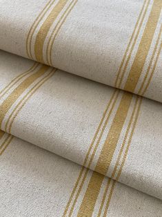 two beige and white striped fabric