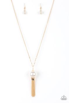 A dramatic pearly white bead swings from the bottom of an elegantly elongated gold chain. Featuring a hammered fitting, a gold tassel streams from the bottom of the colorful pendant for a refined finish. Features an adjustable clasp closure.

Sold as one individual necklace. Includes one pair of matching earrings. Ballroom Necklace, Gold Tassel Necklace, Nickel Free Jewelry, Gold Long Necklace, Paparazzi Accessories, Paparazzi Jewelry, White Beads, Green Bead, Necklace Earring Set