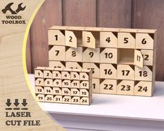 a wooden block set with numbers and times on the front, sitting on top of a table