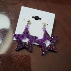 Add Some Sparkle To Your Look With These Gorgeous Purple Acrylic Rhinestone Star Earrings. The Acrylic Material Makes Them Lightweight And Comfortable To Wear All Day Long, While The Beautiful Star-Shaped Design Catches The Light And Adds A Touch Of Glamour To Any Outfit. Perfect For Any Occasion, These Dangle/Drop Earrings Are Sure To Become Your New Favorite Accessory. The Earrings Come In A Beautiful Shade Of Purple That Will Complement Any Outfit And Feature Rhinestones That Give Them A Stun Sparkling Star-shaped Crystal Earrings, Star-shaped Crystal Earrings For Party, Sparkling Star Crystal Earrings For Party, Sparkling Star-shaped Crystal Earrings For Party, Star-shaped Rhinestone Jewelry, Star-shaped Rhinestone Party Jewelry, Galaxy Accessories, Oc Stuff, Purple Acrylic