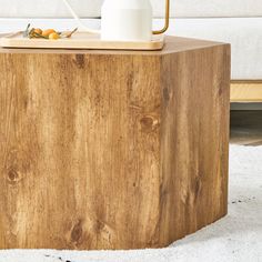 a wooden table with a white jug on it