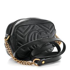 This is an authentic GUCCI Calfskin Matelasse Mini GG Marmont Chain Shoulder Bag in Black. This shoulder bag is crafted of smooth and supple calfskin leather in black. This bag features an aged gold chain with a leather shoulder pad and a Gucci GG logo on the front. The top zipper opens to a beige microfiber interior with a flat pocket. Gg Logo, Gg Marmont, Shoulder Bag Black, Chain Shoulder Bag, Shoulder Pads, Gold Chain, Gold Chains, Calf Skin, Gucci