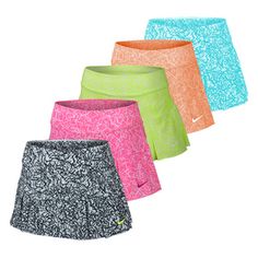 three pairs of women's tennis shorts with different colors and patterns on the bottom