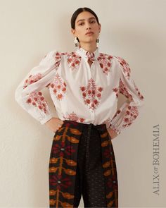 Block-printed by hand, our floral print shirt has long puffed sleeves and a ruffled collar. The shirt has a mother-of-pearl button front and a sheer texture in the swaths of white. Sheer Texture, Pink Dahlia, Hand Printing, Clothing Art, Business Style, Embroidery On Clothes, Floral Print Shirt, Ruffled Collar, Long Puff Sleeves