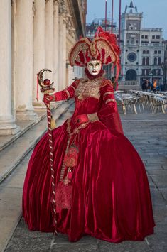 This striking clear image of a female participant in the Venice Carnival is posing for the camera to reveal her beautiful eyes inside the ornate, hand painted traditional mask.  Venice Carnival happens once a year before Easter and lasts two weeks. I have photographed this unique event twice so far and I want to return to do it again. Venice is both classic and romantic and the variance in Venetian costumes makes each carnival unique.  People from all over the world come to attend and most participate even if it involves wearing only a small mask.  The costumes cost in the thousands of dollars and on some nights, large balls are filled with costumed revelers who are donned in glorious fabric, vintage dress shoes, hand painted masks and elaborate wigs. As a photographer, I am constantly see Traditional Masquerade Mask For Carnival, Traditional Red Costume Masks And Prosthetics, Traditional Red Masks And Prosthetics For Costume, Traditional Eye Mask For Masquerade, Artistic Red Masks And Prosthetics For Costume, Traditional Red Masks And Prosthetics For Costume Party, Traditional Carnival Masks And Prosthetics, Traditional Red Masquerade Mask For Carnival, Traditional Masquerade Mask For Theater Festivals