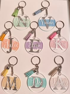 six personalized key chains with tassels in different colors and designs on them