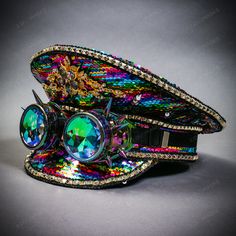 This Listing Is For A Handcrafted, Embellished Festival Party Hat With Match Rhinestone Jewelry. This Hat Made With Rainbow Sequins Also Decorated Rhinestone, Goggles And Jewerly.This Hat Includes A Combination Of Assorted Festive Gaud And Glitz; Such As Sequins, Rhinestones, Beads, Studs, Jewels; Metal And Plastic. The Steampunk Burning Man Captain Hat With Rhinestone Jewelry In Rainbow Is A Unique And Eye-Catching Accessory That Is Perfect For Anyone Looking To Make A Statement At Their Next S Adjustable Festival Headpiece With Rhinestones, Adjustable Rhinestone Festival Headpiece, Adjustable Rhinestone Headpiece For Festival, Festival Hats With Rhinestones And High Crown, Festival Hat With Rhinestones And High Crown, Festival Adjustable Embellished Headpieces, Adjustable Embellished Festival Headpieces, Costume Hat With Rhinestones For Festivals, Party Embellished Adjustable Costume Hats And Headpieces