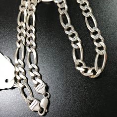 20 1/2" Long Sterling Silver Figaro Chain Necklace. This Necklace Is 9.52 Mm Wide And It Weighs 63 Grams. This Is Italian Silver. This Is A Vintage Chain. Classic Silver Figaro Chain Necklace, Silver Hallmarked Oval Link Chain Necklace, Silver Oval Link Chain Necklace Hallmarked, Silver Figaro Chain Necklace With Oval Links, Silver Sterling Jewelry With Figaro Chain, Sterling Silver Figaro Chain Necklace, Silver Figaro Chain Necklace, Silver Figaro Chain, Wolf Pendant Necklace