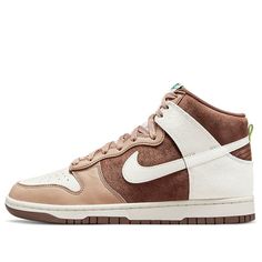 The Nike Dunk High “Light Chocolate” gives an updated look to a retro hoops shoe. The upper is made of brown shaggy suede, with forefoot and heel overlays in light brown leather and Sail-colored suede. There are also perforated leather toe boxes and signature Swooshes in off-white. Bright green heel tabs match the Nike branding hits on the woven tongue tags and sockliners. The durable brown rubber outsole has a traction pattern that was originally created for the hardwood. (SNKR/Skate/Unisex/Hig Nike X Travis Scott, Low Air Jordan 1, Green Heels, Dunks Nike, Nike Dunk High, Dunk High, Nike Shox, Air Jordan 3, Nike Air Max Plus