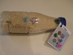 a plastic bottle filled with rice and magnets