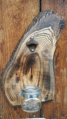 a mason jar hanging on a wooden wall