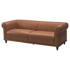 a brown leather couch sitting on top of a white floor