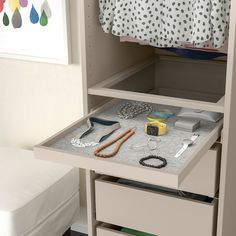 an open drawer with various items on it