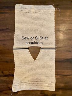 a crocheted dishcloth with the words sew or st at shoulders