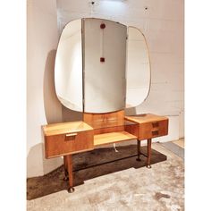 a vanity with a mirror and two drawers