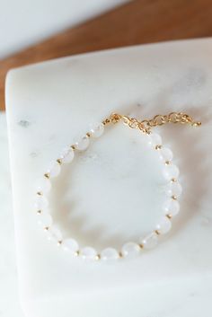 This beautiful bracelet is made with White Jade 6mm beads and 2.5mm 14K Gold-Filled beads. It measures 6.5" with a1 1/2" extender on the end for an adjustable fit. The perfect layering bracelet! White Jade Bracelet, Layer Jewelry, Bracelet Easy, Popular Bracelets, White Bracelet, Stone Bracelets, Simple Organic, Bracelet Minimalist, Gold Bead Bracelets