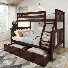 a bunk bed with drawers underneath it in a room that has hardwood floors and white walls