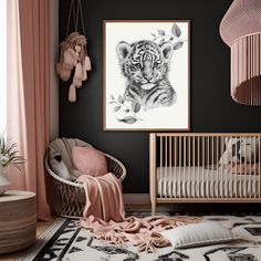 a baby's room decorated in pink and black with a tiger print on the wall