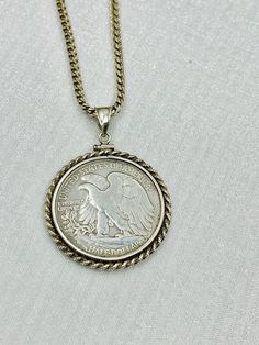 USA 1944 - S Walking Liberty  Sterling Silver Half Dollar  Coin Edge Bezel.  1944 USA. 999 silver eagle  coin Pendant  on a sterling silver Italian rope chain .The total weight: 33.5 grams .  The pendant contains  an authentic 1944 standing liberty silver half dollar / 50 cents coin .  Condition: Pre-owned. Silver Medallion With Rope Chain, Silver Medallion On Rope Chain Jewelry, Silver Medallion Rope Chain Jewelry, Vintage Medallion Necklace With Polished Finish, Silver Medallion Rope Chain Necklace, Classic Stamped 925 Medallion Jewelry, Classic Stamped Coin Jewelry, Classic Engraved Sterling Silver Coin Necklace, Vintage Hallmarked Coin Necklace With Round Pendant