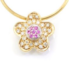 "This classy flower design pendant complimented with mciro pave set round diamonds and pink sapphires is hand crafted and cast in solid 14K yellow gold.  17 inches Snake Chain is included. COMPONENT DIAMOND: 25 Round Diamonds / 7 Pink Sapphire CARAT WEIGHT:  0.27ct / 0.11ct COLOR/CLARITY: G - H / SI METAL:  14K Yellow Gold GRAM WEIGHT:  12.0gr + chain WIDTH:  14.8mm DEPTH:  5.6mm LENGTH: 14.4mm STYLE CODE: P884-KP165 Item can also be made in 18K  white & yellow gold and in platinum with addition Flower Pendant, Snake Chain, Pink Sapphire, Round Diamonds, Flower Designs, Platinum, Sapphire, Fine Jewelry, Yellow Gold