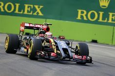 a red and yellow race car driving on a track