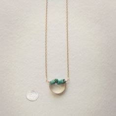 Description A line of semi-precious pebbles create the horizon of this gemstone necklace. Brass curved bar with 14K gold dipped chain. Choose your length. Spring ring closure. You choice of clear quartz, unakite, aquamarine or turquoise semi-precious stone. WHAT IS GOLD DIPPED? Gold dipped is the best alternative to solid gold, and that's why we use gold dipped metals in our jewelry designs. Our gold dipped jewelry components have 150-200 layers of pure solid gold over a base metal. Unlike gold- Adjustable Minimalist Gold Necklace, Modern Turquoise Jewelry For Everyday, Minimalist Healing Jewelry With Natural Stones, Adjustable Metal Gemstone Necklaces, Minimalist Everyday Wire Wrapped Jewelry, Everyday Jewelry With Natural Stones Round Pendant, Minimalist Crystal Necklace With Natural Stones For Everyday, Minimalist Everyday Crystal Necklaces With Natural Stones, Everyday Turquoise Jewelry With Adjustable Chain