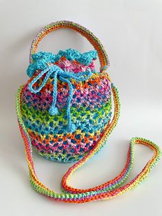 a crocheted purse and matching wrist strap