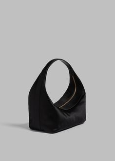 Color: Black Smooth satin Structured shape Single strap Interior zip-up pouch Top zip closure 72% Viscose 28% Silk By Loulou Studio. Imported Evening Structured Soft Leather Bag, Structured Soft Leather Evening Bag, Evening Shoulder Bag With Top Handle And Zipper Pocket, Evening Shoulder Bag With Zipper Pocket And Top Handle, Evening Clutch Shoulder Bag With Zipper, Evening Clutch With Zipper Closure, Elegant Evening Hobo Bag With Zipper Closure, Evening Hobo Shoulder Bag With Zipper, Evening Shoulder Bag With Zipper Pocket