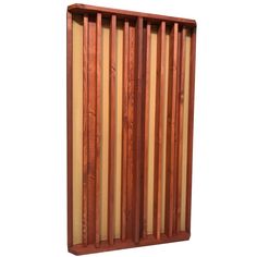 a wooden wall hanging on the side of a white wall with strips of wood in it