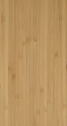 a close up view of a bamboo board textured with light brown wood grains