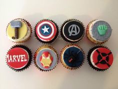 the cupcakes are decorated with captain america, iron man, and avengers symbols