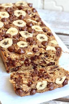 chocolate chip peanut butter oatmeal banana bread is cut in half and stacked on top of each other