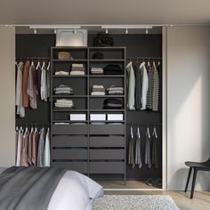 an open closet with clothes hanging on the walls